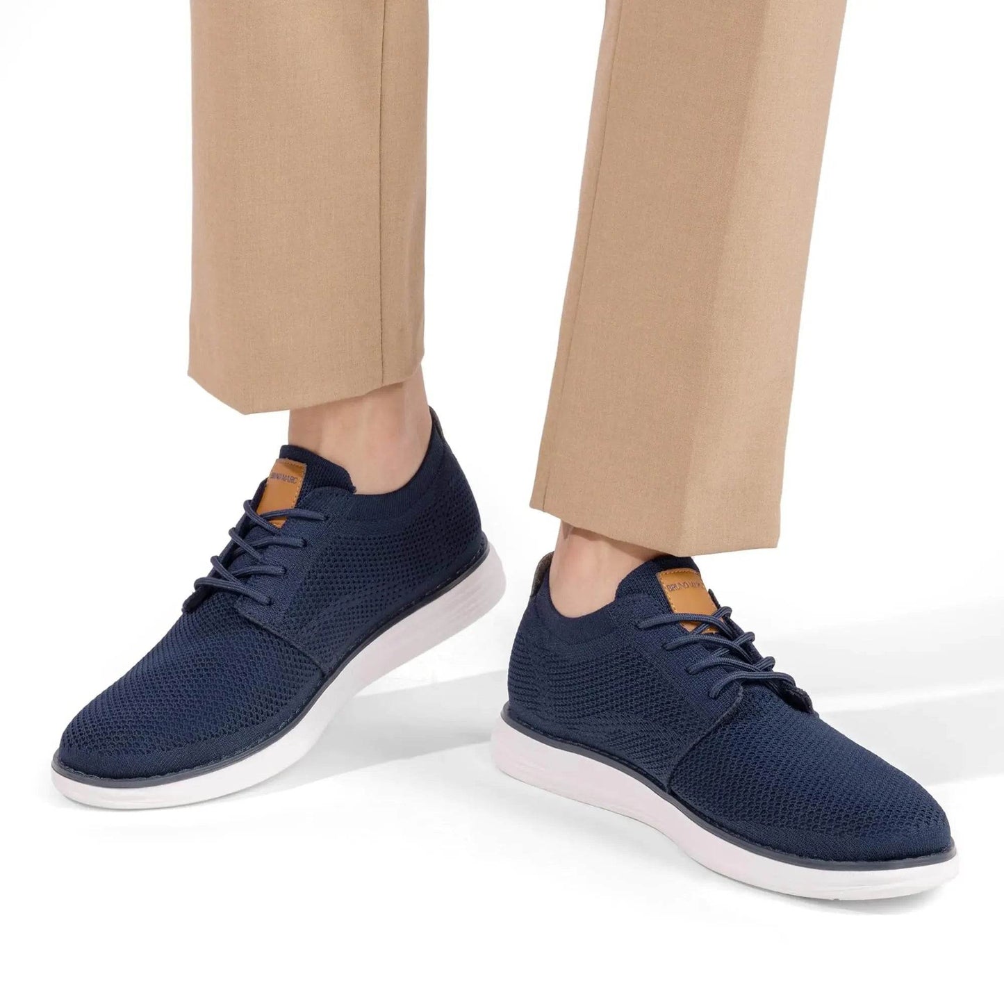 Solstik navy blue lightweight men's sneakers with white soles worn with beige pants