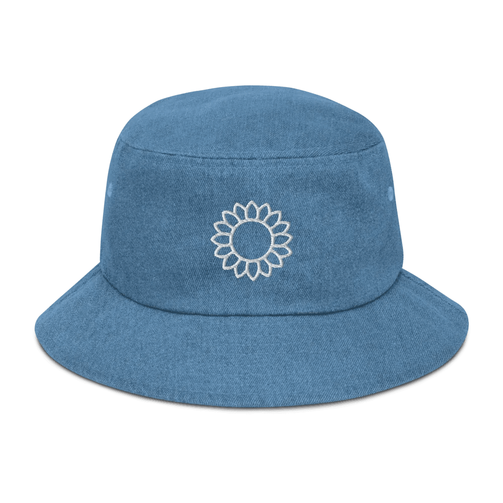 Solstik embroidered denim bucket hat in blue with a white floral embroidery on the front