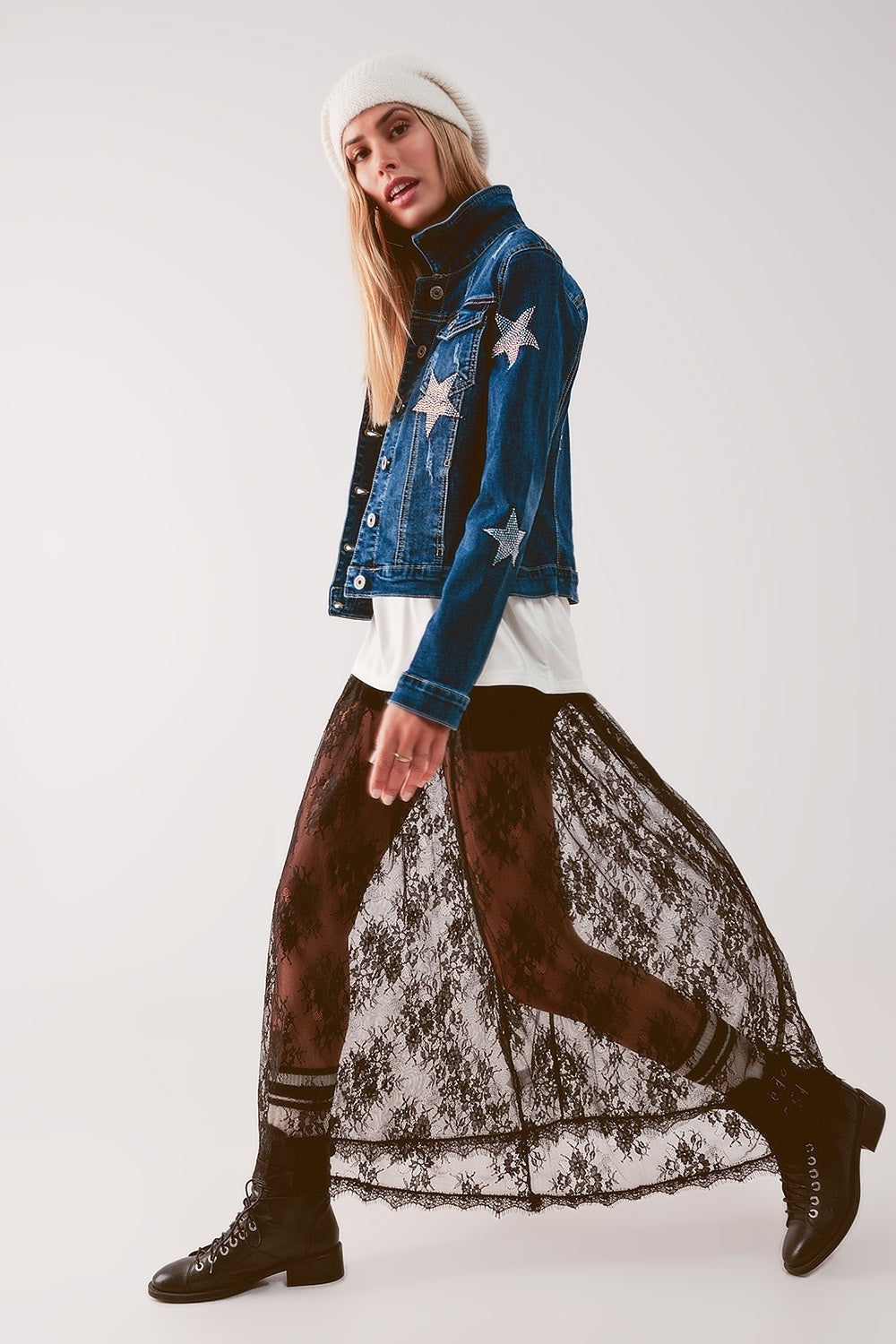 Q2 luxury women's denim outerwear with star patches styled with lace skirt and boots