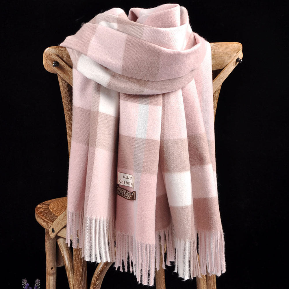 Solstik premium cozy wool scarf in pink and beige checkered pattern draped over wooden chair