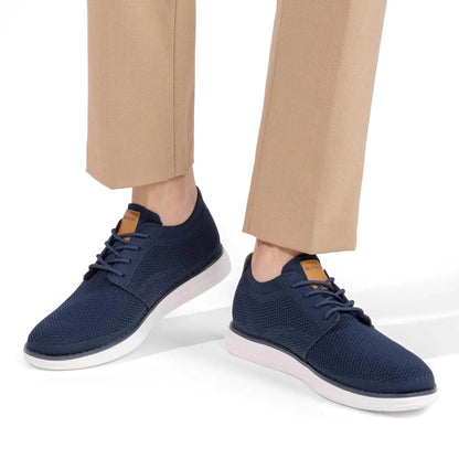 Solstik navy blue lightweight men's sneakers with white soles worn with beige pants