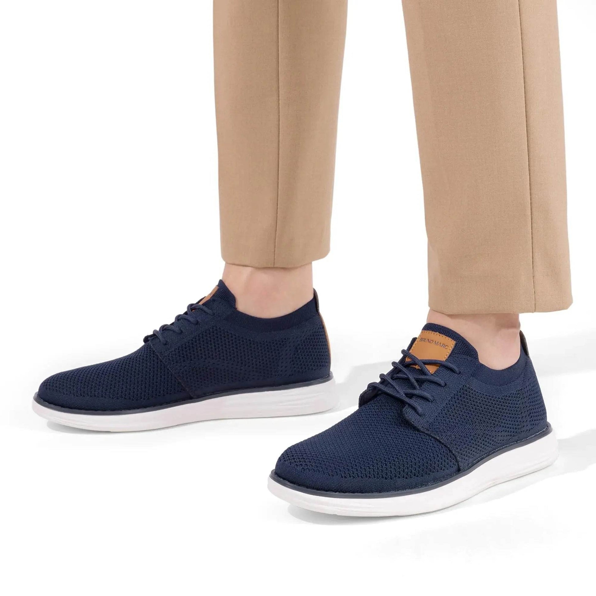 Solstik navy blue knitted lightweight men's sneakers with white soles worn with beige pants
