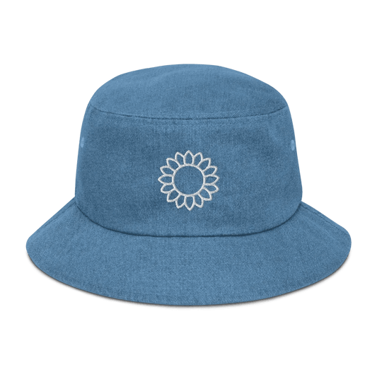 Solstik embroidered denim bucket hat in blue with a white floral embroidery on the front