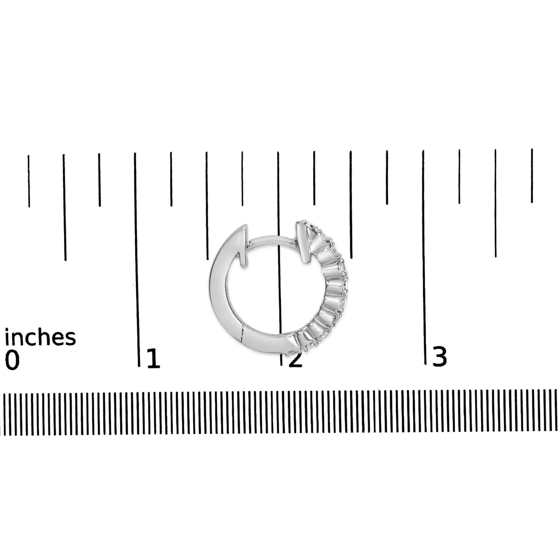 Solstik fine diamond hoop earrings shown next to ruler for size reference