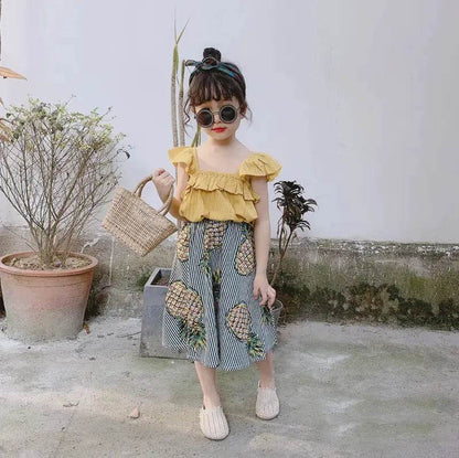 Cute girls pineapple skirt and top set with yellow ruffled top and striped skirt with pineapple print