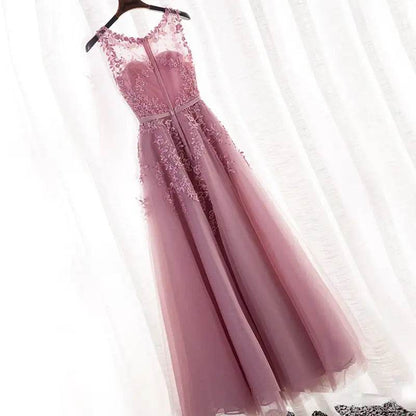 Elegant pink luxury bridesmaid gown for summer with floral lace details and sheer neckline