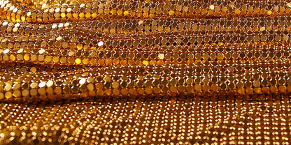 Evelyn Belluci luxury chainmaille cocktail dress with shimmering gold metal discs for elegant evening wear