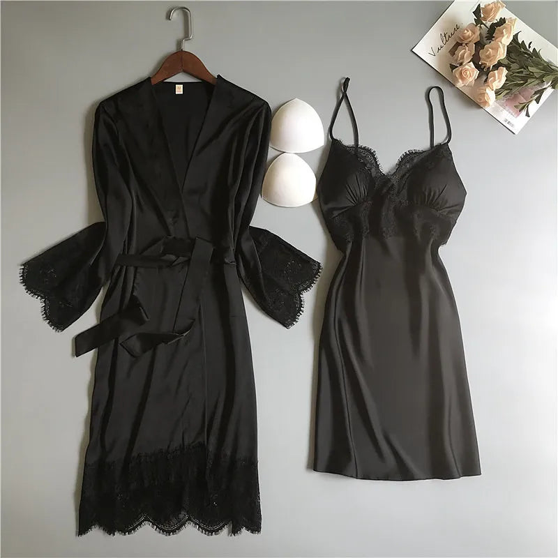 Solstik luxury silk robe set featuring a black lace trim robe and matching slip dress on gray background
