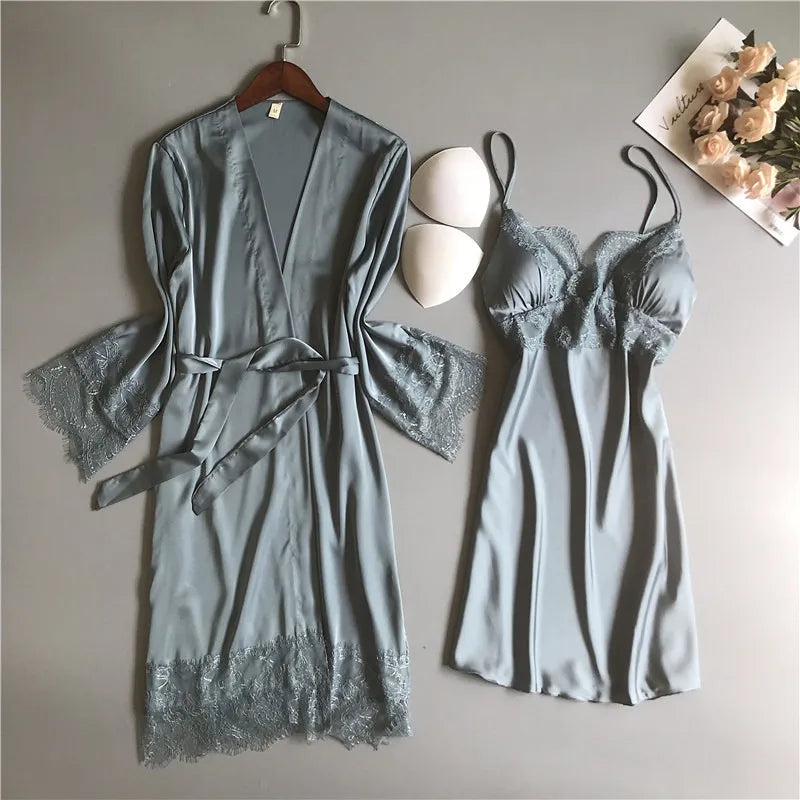 Solstik luxury silk robe set in soft blue with lace trim featuring a belted robe and matching slip dress