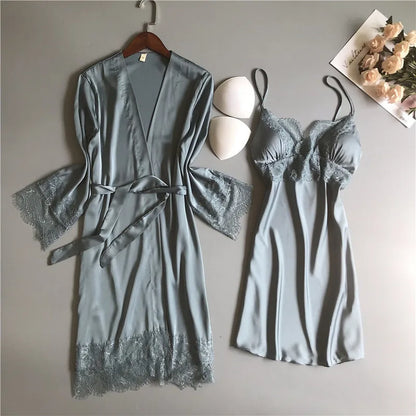 Solstik luxury silk robe set in soft blue with lace trim featuring a belted robe and matching slip dress