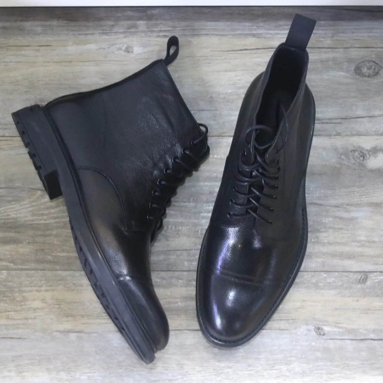Men's black leather formal boots by Solstik with lace-up design and sleek polished finish