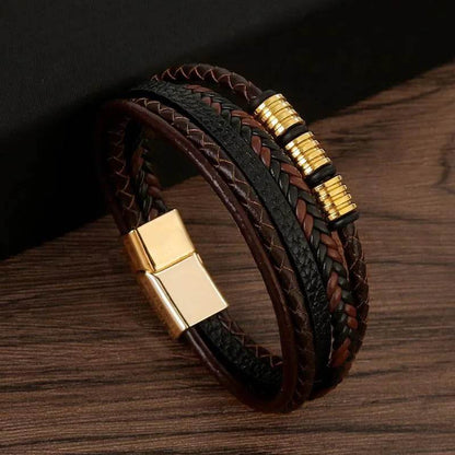 Solstik men's braided leather wristband in black and brown with gold magnetic clasp and decorative accents
