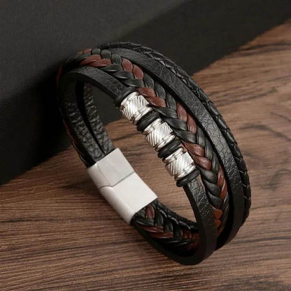 Solstik men's braided leather wristband with black and brown leather strands and silver bead accents