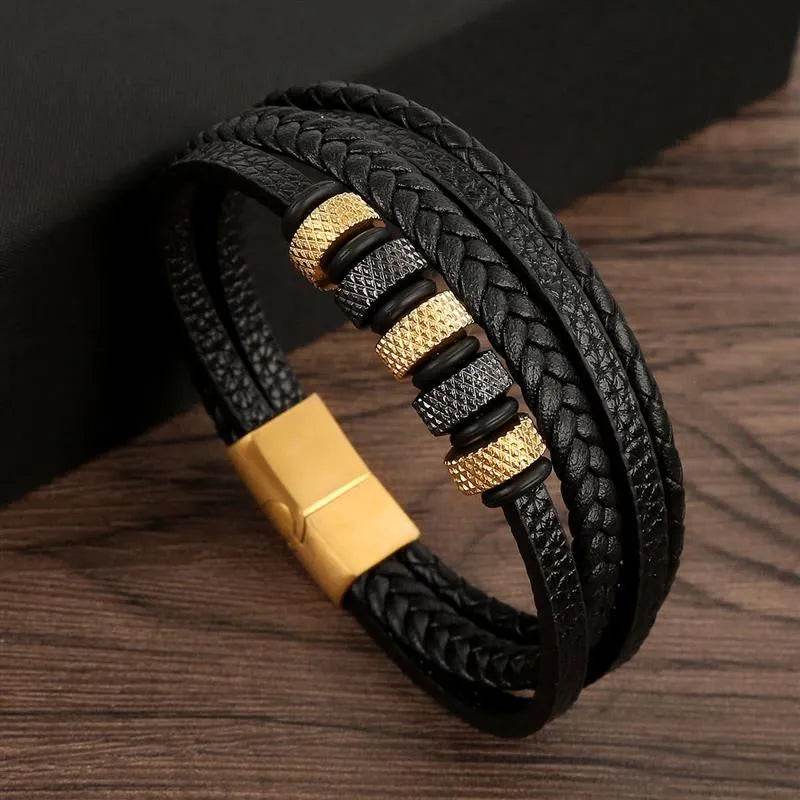 Solstik men's braided leather wristband with black and gold metal accents and magnetic clasp