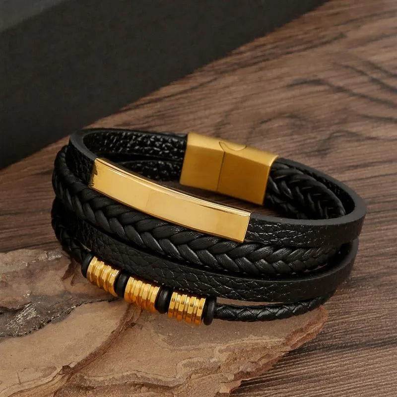 Solstik men's braided leather wristband in black with gold accents and magnetic clasp