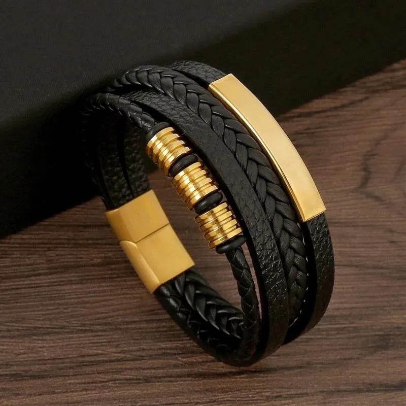 Solstik men's braided leather wristband with black leather and gold accent details