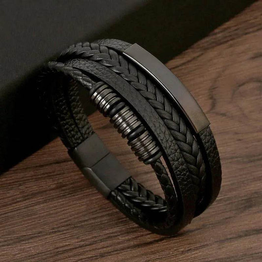 Solstik men's braided leather wristband with black braided and textured leather straps and metal accents