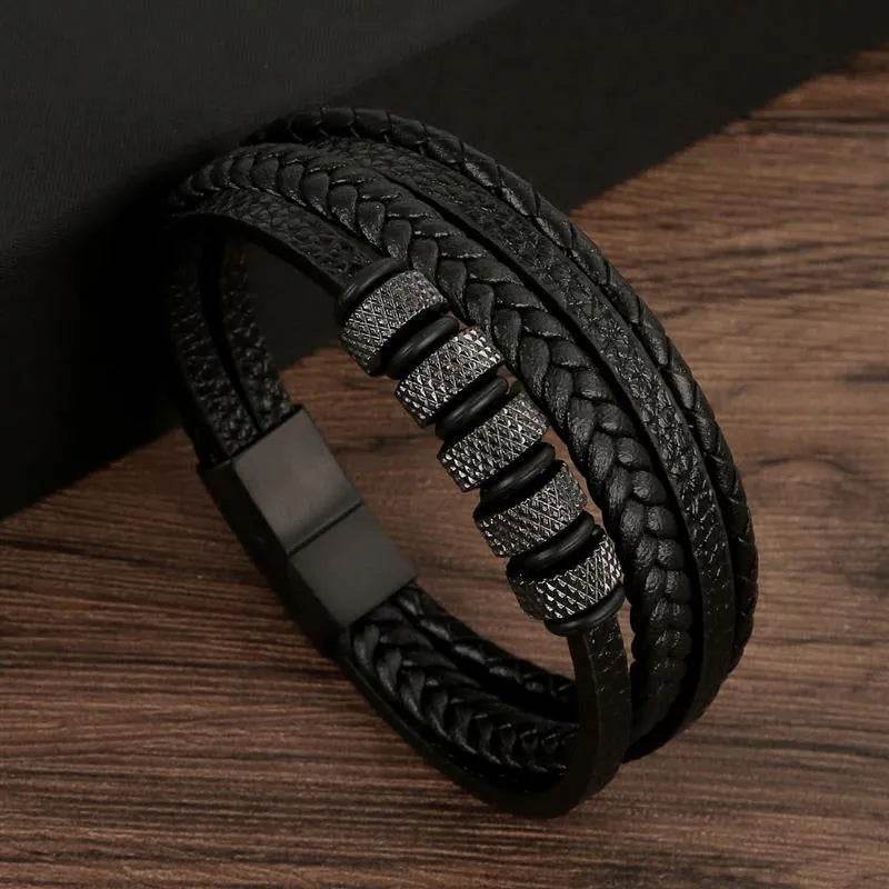 Solstik men's braided leather wristband in black with decorative metal accents and magnetic clasp