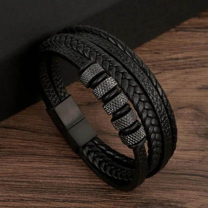 Solstik men's braided leather wristband in black with decorative metal accents and magnetic clasp