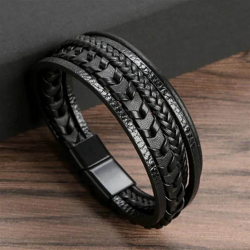Solstik men's braided leather wristband in black with multiple woven leather strands and magnetic clasp