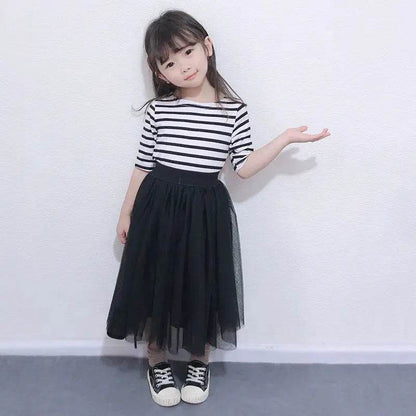 Young girl wearing black skirt and striped top in mother daughter matching outfits by Solstik