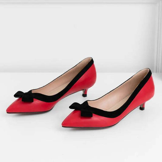 Solstik red kitten heels with bow and black trim featuring pointed toes and low heels