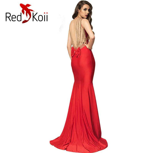 Plus size red backless gown with a fitted silhouette and bow detail at the lower back by Solstik