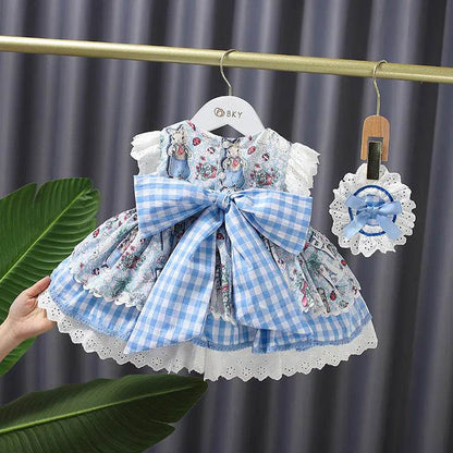 Solstik blue and white princess gown for girls with floral print and large checkered bow