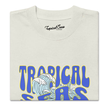 Solstik Tropical Seas folded statement oversized summer shirt with blue wave graphic on cream fabric