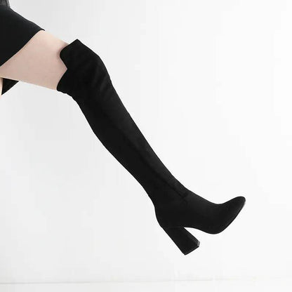 Solstik black velvet stretch thigh high boots with block heel worn with black skirt
